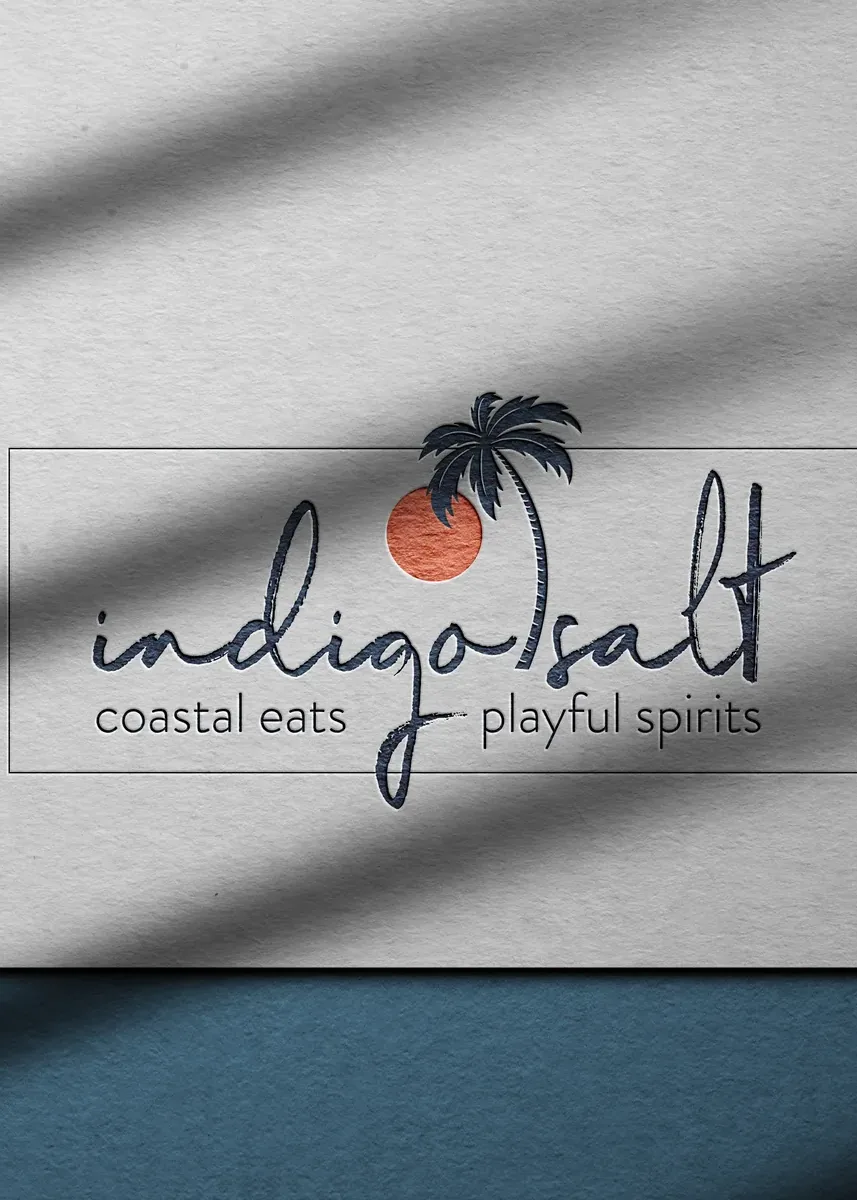 The Indigo Salt wordmark printed on paper in raking light
